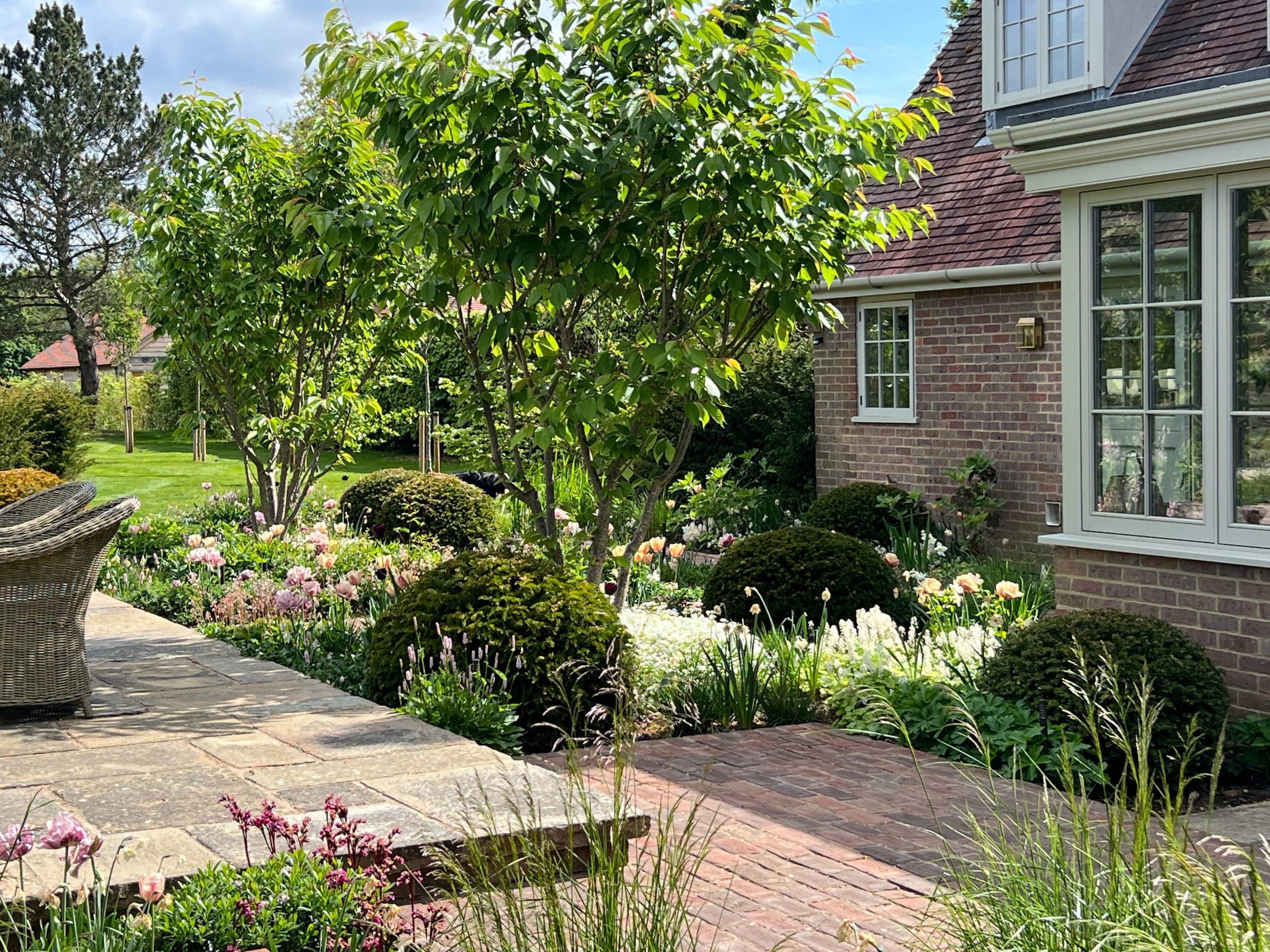 Garden terrace with two levels of stone paving.